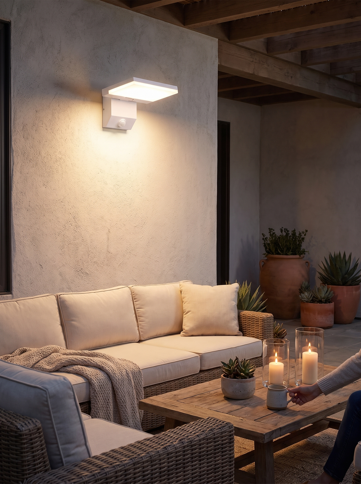 LumiFold outdoor wall light sealed against rain on an exterior wall
